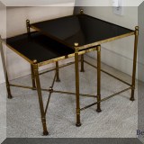 F65. Pair of brass nesting side tables. 